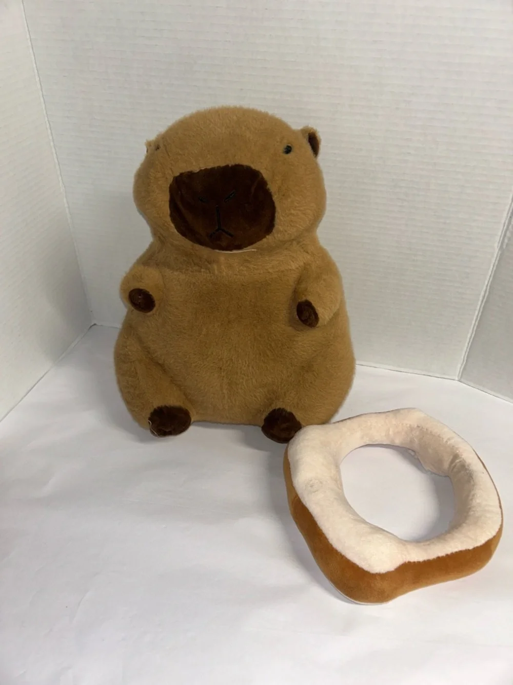 Plush Brown Capybara Pet Toy with Orange-and-White Donut Collar